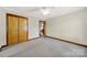 Empty bedroom with neutral colored carpeting, closet and natural lighting at 3017 Lynwood Dr, Lancaster, SC 29720