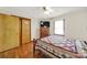 Bedroom with hardwood floors, ceiling fan, closet, and a large window at 3017 Lynwood Dr, Lancaster, SC 29720