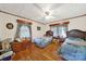 Charming bedroom features two twin beds, hardwood floors, and a ceiling fan at 3017 Lynwood Dr, Lancaster, SC 29720