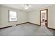 Large empty bedroom with neutral colored carpeting and a window at 3017 Lynwood Dr, Lancaster, SC 29720