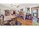 This dining room features hardwood floors, a brick fireplace, and a round table with seating for four at 3017 Lynwood Dr, Lancaster, SC 29720