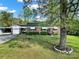 Charming brick house showcasing a well-kept lawn, mature trees, and welcoming curb appeal at 3017 Lynwood Dr, Lancaster, SC 29720