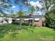 A neatly landscaped yard in front of this brick home invites you in with classic charm at 3017 Lynwood Dr, Lancaster, SC 29720