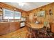 Eat-in kitchen features wood paneling, abundant natural light and a round dining table at 3017 Lynwood Dr, Lancaster, SC 29720