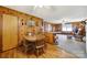 Spacious living room with wood paneled walls and open to kitchen and dining area at 3017 Lynwood Dr, Lancaster, SC 29720