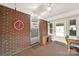 The sunroom has brick walls, neutral carpeting, white paneled ceiling and access to the exterior at 3017 Lynwood Dr, Lancaster, SC 29720