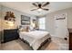 Cozy bedroom featuring a ceiling fan, neutral colors, a window, and playful decor at 3021 Patchwork Ct, Fort Mill, SC 29708