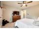 Cozy bedroom featuring a large TV, dresser, and hardwood floors at 3021 Patchwork Ct, Fort Mill, SC 29708