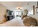 Bright bonus room with desk, large TV, comfortable beanbags, and plenty of natural light at 3021 Patchwork Ct, Fort Mill, SC 29708