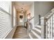 Bright entryway with wood floors, natural light, and staircase access at 3021 Patchwork Ct, Fort Mill, SC 29708