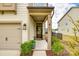 Inviting front entrance with a stylish wreath, decorative plants, and house number at 3021 Patchwork Ct, Fort Mill, SC 29708