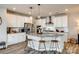 Kitchen island with granite countertops, stainless steel appliances, white cabinetry, and pendant lighting at 3021 Patchwork Ct, Fort Mill, SC 29708