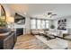 Cozy living room area with fireplace, ceiling fan, tv and hardwood flooring at 3021 Patchwork Ct, Fort Mill, SC 29708