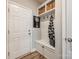 Welcoming mudroom with built-in storage bench, hooks, and shelving to keep organized as you enter the home at 3021 Patchwork Ct, Fort Mill, SC 29708