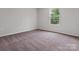 Bedroom featuring neutral carpet, a window with natural light, and electrical outlets at 3034 Trailblazer St, Charlotte, NC 28215