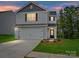 Charming two-story home with a two-car garage and well-maintained lawn, perfect for suburban living at 3034 Trailblazer St, Charlotte, NC 28215
