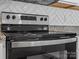 The kitchen range, with its stainless-steel design and backsplash, combines functionality with modern aesthetics at 3034 Trailblazer St, Charlotte, NC 28215