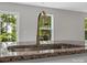 Close-up of a kitchen sink features granite countertop and a window with green trees, highlighting its serene view at 3034 Trailblazer St, Charlotte, NC 28215