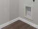 Well-maintained laundry room corner featuring wood-look flooring and a recessed area for laundry hookups at 3034 Trailblazer St, Charlotte, NC 28215
