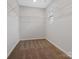Walk-in closet with carpeted floor and wire shelving, showcasing practical storage solutions at 3034 Trailblazer St, Charlotte, NC 28215