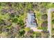 Bird's-eye view of a well-maintained home with a spacious backyard, lush landscaping, and a peaceful surrounding at 310 Frontier Cir, Indian Trail, NC 28079