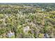 Scenic aerial view of homes nestled among lush greenery, showcasing a peaceful residential area with mature trees at 310 Frontier Cir, Indian Trail, NC 28079