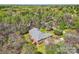 Aerial view of a well-maintained home with lush landscaping, a two-car garage, and beautiful surroundings at 310 Frontier Cir, Indian Trail, NC 28079