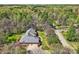 Aerial view of the home and its private, wooded setting at 310 Frontier Cir, Indian Trail, NC 28079