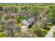 Beautiful home nestled in a lush, green landscape with mature trees and an attached two-car garage at 310 Frontier Cir, Indian Trail, NC 28079
