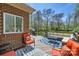 Relax on the back deck, complete with comfortable furniture, grill, and scenic views at 310 Frontier Cir, Indian Trail, NC 28079
