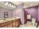 Well-lit bathroom with a double vanity, neutral colors, and a separate shower area at 310 Frontier Cir, Indian Trail, NC 28079