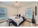 Inviting bedroom with a ceiling fan, windows, and a comfortable layout, perfect for relaxation at 310 Frontier Cir, Indian Trail, NC 28079