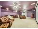 Large home theater with comfortable seating, a projector, and a popcorn machine at 310 Frontier Cir, Indian Trail, NC 28079