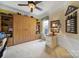 Cozy bedroom with a unique Murphy bed and custom built-in shelving at 44455 Oriole Dr # 100, Indian Land, SC 29707