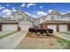 Attractive townhomes with two-car garages and manicured landscaping in a well-kept neighborhood at 44455 Oriole Dr # 100, Indian Land, SC 29707