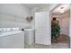 Functional laundry room with modern washer and dryer, and convenient storage shelf at 44455 Oriole Dr # 100, Indian Land, SC 29707