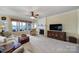 Bright living room with a fireplace, large windows, and comfortable seating at 44455 Oriole Dr # 100, Indian Land, SC 29707