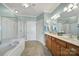 The main bathroom includes dual sinks, a soaking tub, and a separate glass-enclosed shower at 44455 Oriole Dr # 100, Indian Land, SC 29707