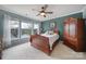 Comfortable main bedroom offers natural light and views of the lake, plus an ensuite at 44455 Oriole Dr # 100, Indian Land, SC 29707