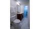 Clean bathroom with toilet, vanity and mirror with a shower/tub in the background at 4609 Hedgemore Dr # I, Charlotte, NC 28209