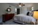 Bright bedroom features a comfortable queen bed, ceiling fan and nice size closet at 4609 Hedgemore Dr # I, Charlotte, NC 28209