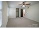 The bedroom is brightly lit and includes carpet and a closet with white sliding doors at 4609 Hedgemore Dr # I, Charlotte, NC 28209