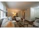 Comfortable living room featuring hardwood floors, large window, stylish seating, and tasteful decor, creating a warm and inviting space at 4609 Hedgemore Dr # I, Charlotte, NC 28209