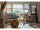 Cozy living room featuring a comfortable sofa, throw pillows, and lots of natural light at 4609 Hedgemore Dr # I, Charlotte, NC 28209