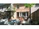 This outdoor patio features outdoor seating, privacy fencing and a brick finish at 4609 Hedgemore Dr # I, Charlotte, NC 28209