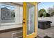 A view of the patio with hot tub from the sunroom at 4808 Truscott Rd, Charlotte, NC 28226