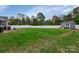 Expansive backyard with a well-maintained lawn, shed, and privacy fence at 4808 Truscott Rd, Charlotte, NC 28226