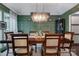 Chic dining room with modern chandelier, dark wood table with upholstered chairs and stylish decor at 4808 Truscott Rd, Charlotte, NC 28226