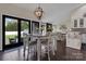 Charming dining area with a white table, wood floors, backyard views, and an open floor plan at 4808 Truscott Rd, Charlotte, NC 28226