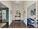 Bright foyer with dark wood floors and high ceilings, offering a view of multiple living spaces at 4808 Truscott Rd, Charlotte, NC 28226